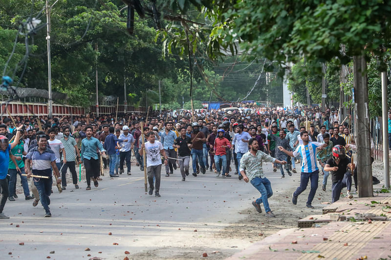 Bangladesh Chhatra League leaders and activists are chasing the students waging a movement seeking a reform in quota system in government jobs on Dhaka University campus on 15 July 2024